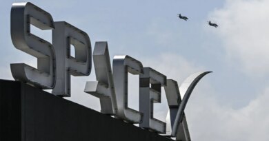 US billionaire businessman and pilot Jared Isaacman flies in formation aboard a fighter jet over the SpaceX sign, close to the Starship spacecraft, before his third test flight from Starbase in Boca Chica, Texas, on March 13, 2024.