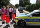 Police and members of a crisis intervention team speak to people near the scene where five people were killed in a shooting in Stade, northern Germany. Photo: 29 June 2026
