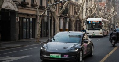 Tesla Model 3 vehicle drives on the street on February 27, 2025 in Shanghai, China.
