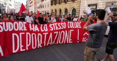 People hold a banner in Italian reading "Skin and sweat have the same color, no deportation' during a march in Rome, Saturday, June 13, 2026, to protest Italy's security and migration package, including a migrant "repatriation bonus" scheme criticized by opposition parties and legal groups as unconstitutional and ethically problematic. (AP Photo/Gregorio Borgia)