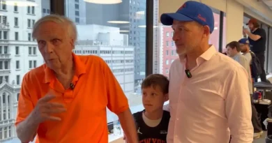 Three generations of Knicks fans celebrate by watching the championship parade
