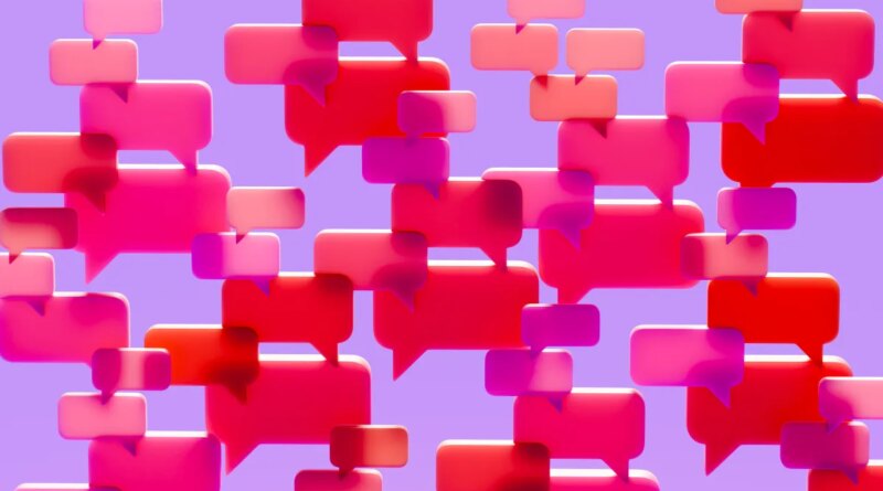 Conceptual image of a dense cluster of three-dimensional speech bubbles in shades of pink red and magenta overlapping and filling the visual field against a solid vibrant purple background.