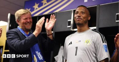 King Willem-Alexander of the Netherlands and Curacao goalkeeper Eloy Room