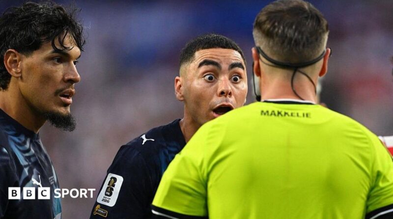 Paraguay forward Miguel Almiron reacts to Dutch referee Danny Makkelie's decision to book him for diving