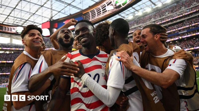 USA players celebrate scoring against Paraguay