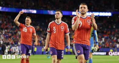 John McGinn, Andy Robertson and Lawrence Shankland salute the travelling Scotland fans