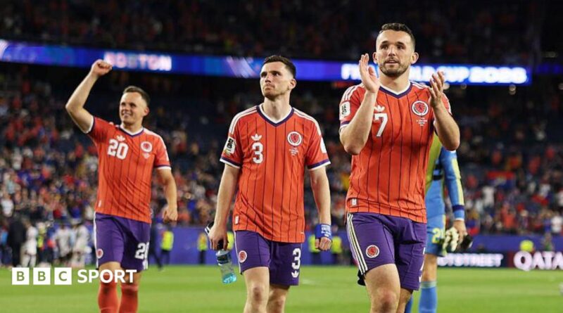 John McGinn, Andy Robertson and Lawrence Shankland salute the travelling Scotland fans