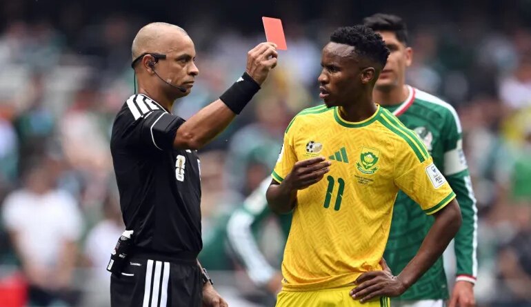 Brazilian referee Wilton Sampaio shows a red card to South Africa's midfielder #11 Themba Zwane during the 2026 World Cup Group A football match between Mexico and South Africa