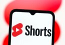 In this photo illustration, the YouTube Shorts logo is seen displayed on a smartphone screen.