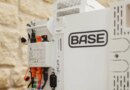A Base Power battery sits next to a home.