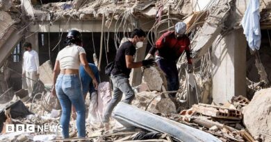 Family members and volunteers search through the rubble after two 17-story buildings in the Belo Horizonte residential complex collapsed in Catia La Mar, La Guaira (Venezuela), on June 26, 2026.