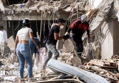 Family members and volunteers search through the rubble after two 17-story buildings in the Belo Horizonte residential complex collapsed in Catia La Mar, La Guaira (Venezuela), on June 26, 2026.