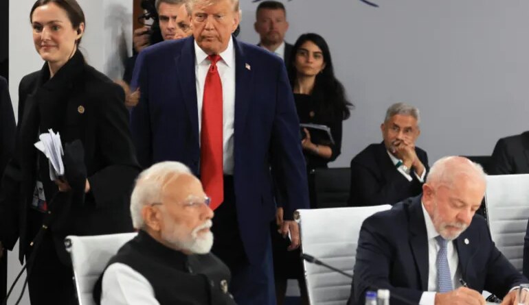 US President Donald Trump arrives as India's Prime Minister Narendra Modi (L) and Brazil's President Luiz Inacio Lula da Silva (R) attend a morning work meeting to “revive balanced, inclusive, and sustainable economic growth for the benefit of all” in the presence of the G7 countries, partner countries, the International Monetary Fund, and the OECD, as part of the G7 summit, in Evian, eastern France, on June 17, 2026.