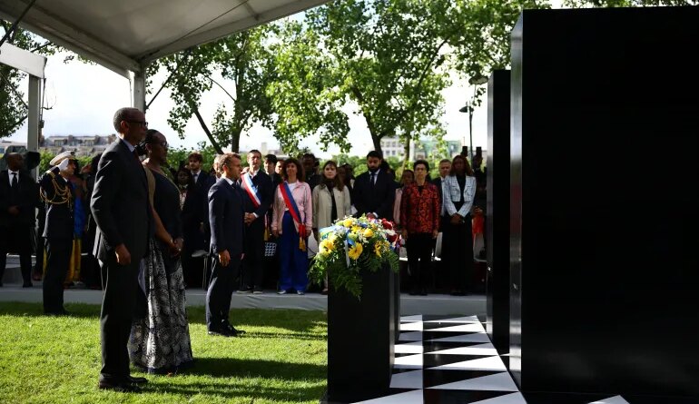 (From L) Rwanda's President Paul Kagame, Rwanda's First Lady Jeannette Kagame and France's President Emmanuel Macron stand after laying wreaths of flowers on a monument for honouring the victims of the Rwanda's genocide made by the Portuguese artist Grada Kilomba, during a ceremony on the Habib-Bourguiba Esplanade along the Seine River in Paris, on June 2, 2026. (Photo by Sarah Meyssonnier / POOL / AFP) / RESTRICTED TO EDITORIAL USE - MANDATORY MENTION OF THE ARTIST UPON PUBLICATION - TO ILLUSTRATE THE EVENT AS SPECIFIED IN THE CAPTION