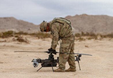 A US soldier prepares an Anduril-built drone for flight during a training exercise.