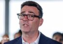 Andy Burnham in a suit and glasses. A close up of his face.