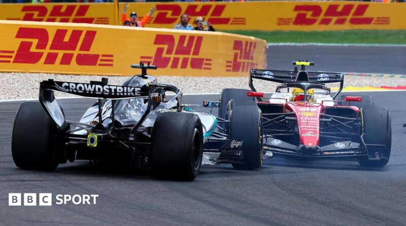 A view of the rear of the Mercedes of George Russell as it spins out of the race, after colliding with Ferrari's Lewis Hamilton on the first lap of the Belgian Grand Prix