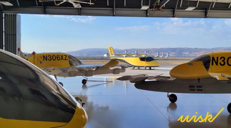 4 yellow wisk evtol in a hangar overlooking hills