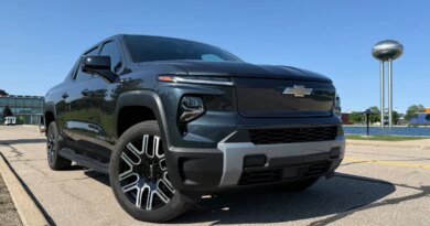 Chevy built an all-American EV truck — why is nobody buying it? | TechCrunch A Silverado EV stands with its front wheels turned.