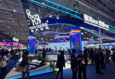 People walk past the Novo Nordisk booth at the 8th China International Import Expo (CIIE) in Shanghai, China November 6, 2025. REUTERS/Andrew Silver