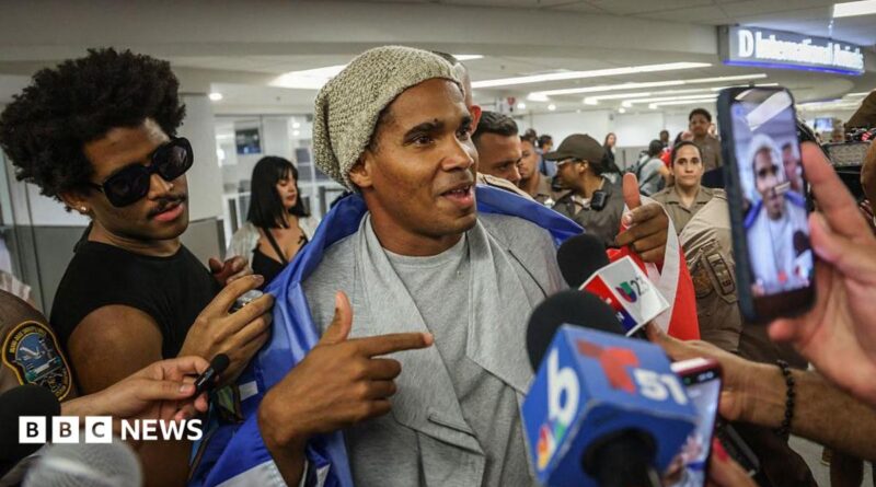 Luis Manuel Otero Alcántara speaks to journalists at Miami airport.