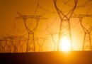 Silhouetted electricity pylon grid