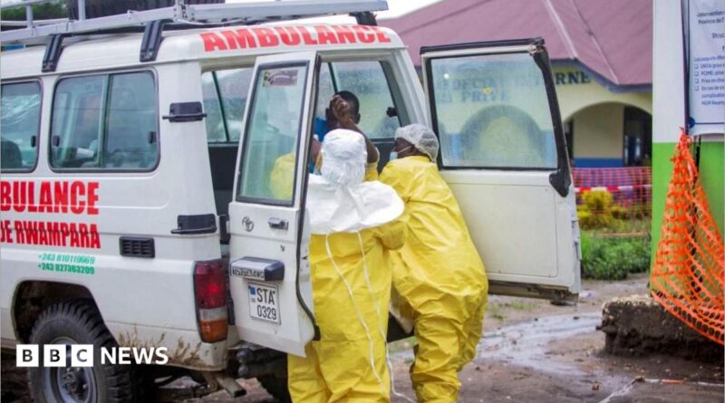 Congolese health workers receive a patient at the Rwampara General Hospital