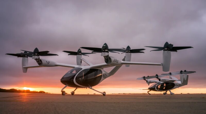 two joby aviation evtols set in front of a sunset