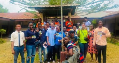 Participants in an Archive Liberia oral history project pose for a group photograph