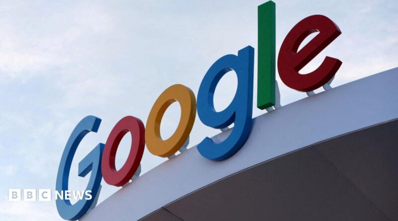 Google's primary-colored logo outside of a building.