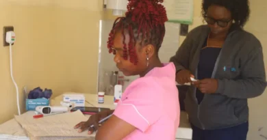 A healthworker assisting patients in a telehealth centre in Nyazura, Zimbabwe (Farai Shawn Matiashe:Al Jazeera)-1784812410