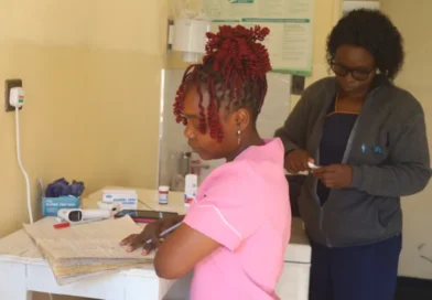 A healthworker assisting patients in a telehealth centre in Nyazura, Zimbabwe (Farai Shawn Matiashe:Al Jazeera)-1784812410