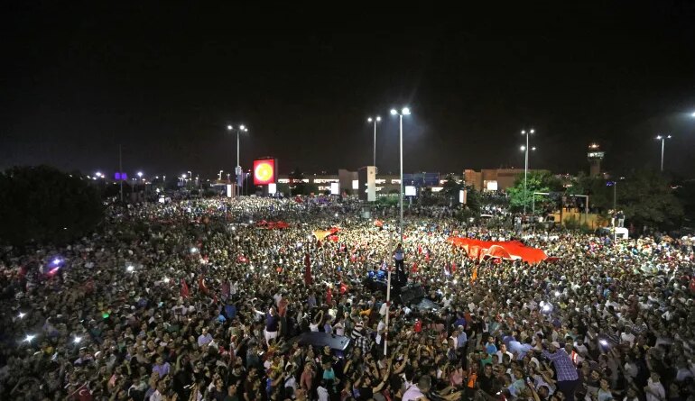 People demonstrate outside Ataturk international airport during an attempted coup in Istanbul
