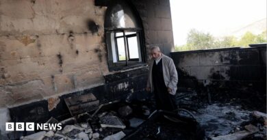 A Palestinian man inspects the damage at a mosque, which Palestinians say was damaged by Israeli settlers, in Qusra near Nablus, in the Israeli-occupied West Bank, July 26, 2026.