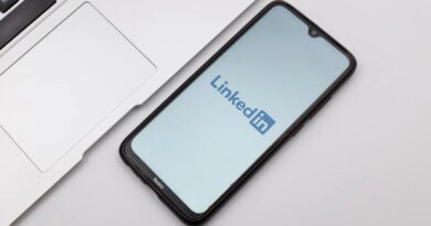 LinkedIn mobile app displayed on smartphone set on desk