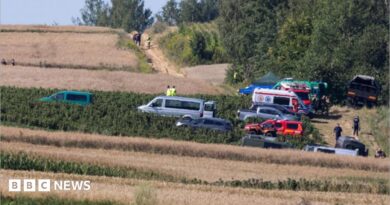 Emergency services work at the site where an unidentified flying object, believed to be a Russian cruise missile, as Ukraine's foreign minister said on Thursday, fell after violating Polish airspace
