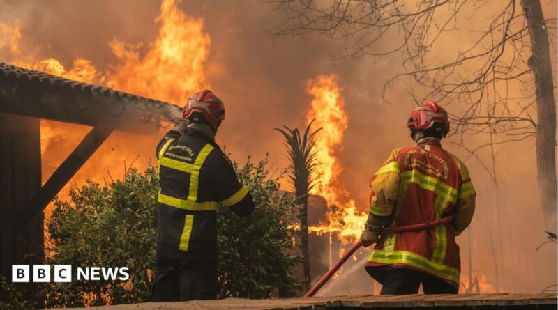 A firefighting crew deployed to battle a wildfire spreading in Lege-Cap-Ferret, south western France, late 24 July 2026.