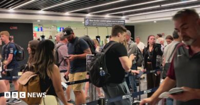 People move through the queue for the Entry Exit System process at Fuimicino Airport in Rome, Italy.