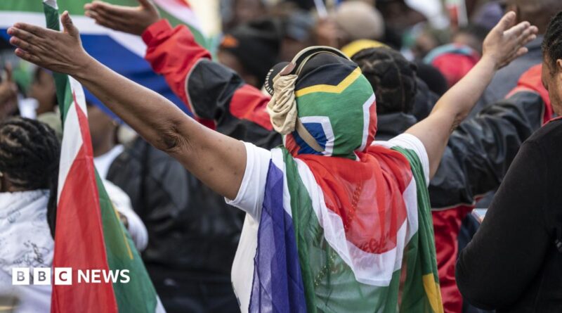 Protesters draped in South African flags in a rally against undocumented immigrants during a nationwide anti-immigration shutdown in Cape Town, South Africa, 30 June 2026.