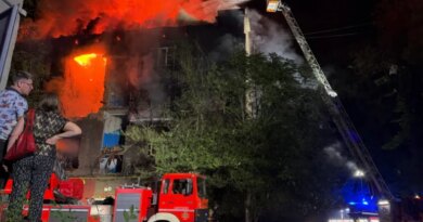 Ukrainian rescuers work to extinguish a fire at a damaged residential building following a Russian drone strike late night in Zaporizhzhia on July 12, 2026, amid the Russian invasion of Ukraine.