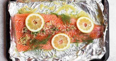 A full salmon fillet marinating in lemon dill salmon marinade