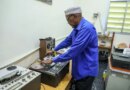 Abdiqadir Geedi Robleh cues up a tape, ready to hear a recording for the first time in years. [Abdimajid Abdillahi Farah/Al Jazeera]