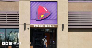 A person enters a Taco Bell restaurant on July 14, 2026 in Pasadena, California.