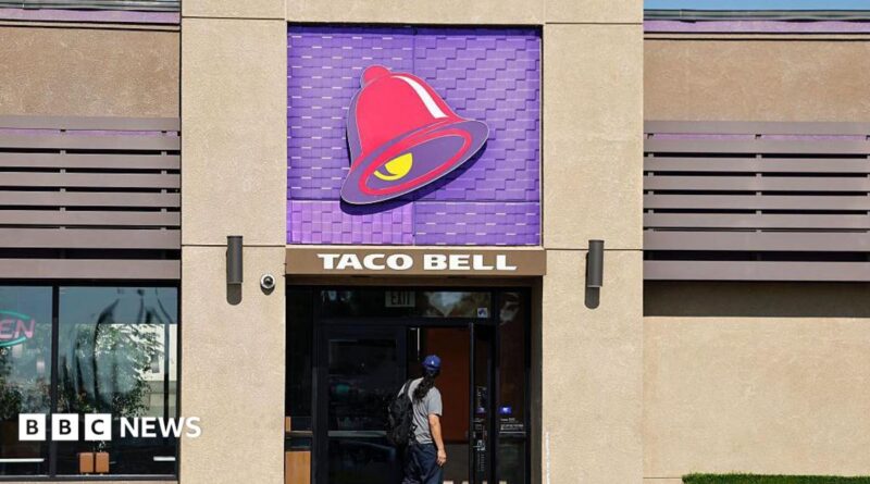 A person enters a Taco Bell restaurant on July 14, 2026 in Pasadena, California.