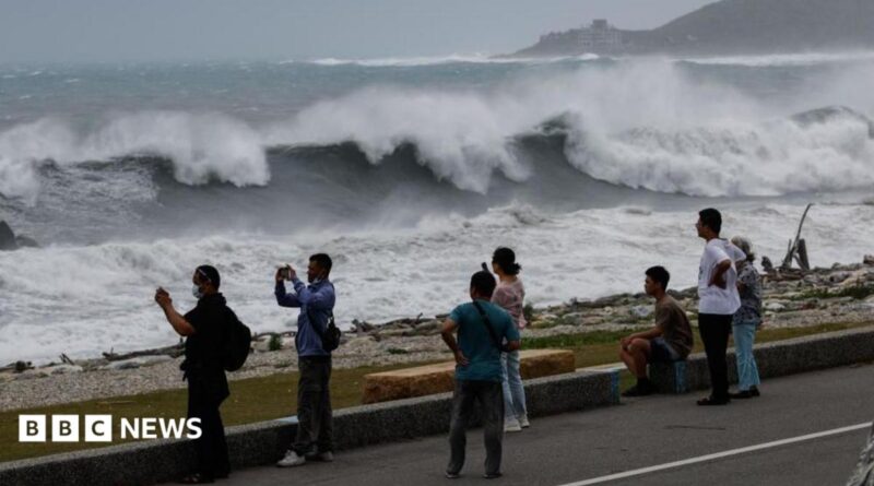 Residents observe huge waves brought by Typhoon Bavi in Hualien city, Taiwan