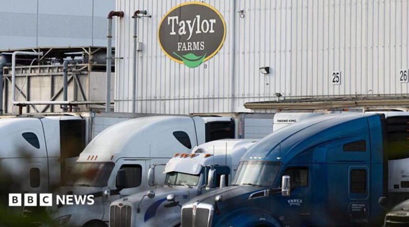 View of Taylor Farms building with trucks in front of it