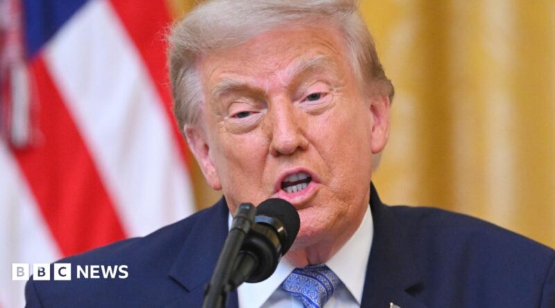 Donald Trump speaking at a podium on 16 July
