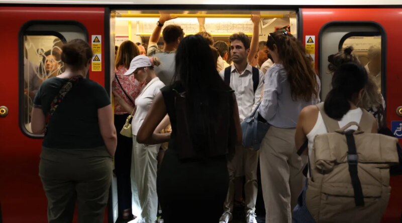 Commuters travel on a London Underground tube carriage, during a heatwave, in central London on June 24, 2026.