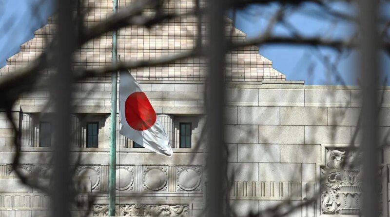 a Japanese flag fluttering in the wind in the distance in front of a building in Tokyo