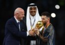 Soccer Football - FIFA World Cup Qatar 2022 - Final - Argentina v France - Lusail Stadium, Lusail, Qatar - December 18, 2022 Argentina's Lionel Messi kisses the trophy as he is presented it by FIFA president Gianni Infantino alongside Emir of Qatar Sheikh Tamim bin Hamad Al Thani REUTERS/Kai Pfaffenbach